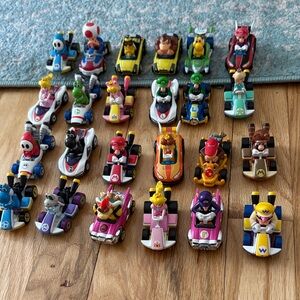 collection of Hot Wheels Mario Kart die-cast character vehicles